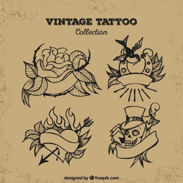 Gratis vector set van vier getrokken vintage hand tattoos