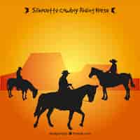 Gratis vector silhouet van drie cowboys rijden