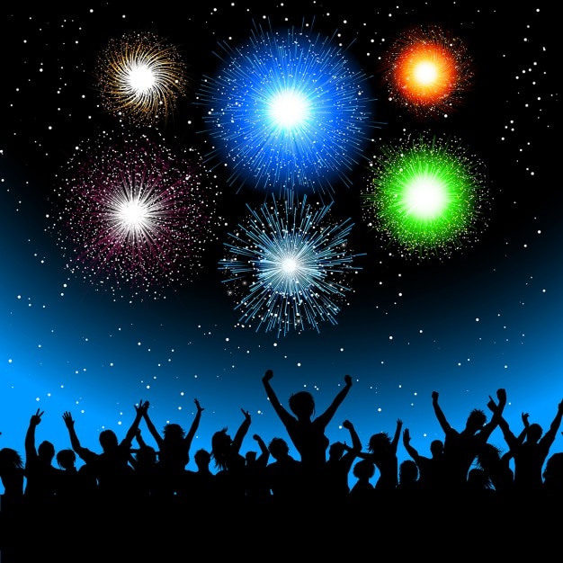 Gratis vector silhouet van een partij menigte tegen een hemel gevuld met exploderende vuurwerk