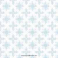 Gratis vector snowflakes patroon met bloemen