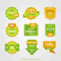 Gratis vector spring sale labels en badges in groene en gele kleuren