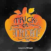 Gratis vector truc of behandel het beletteringsontwerp van halloween