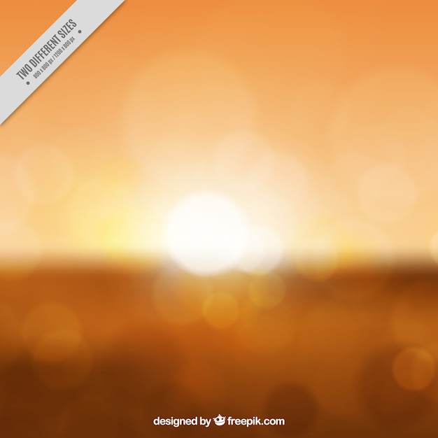 Gratis vector vage oranje zonsondergang achtergrond