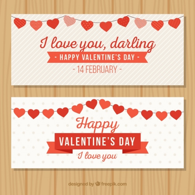 Gratis vector valentijnsdag banners met hart slingers