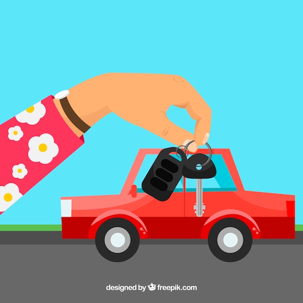 Gratis vector vlakke hand met auto sleutel achtergrond