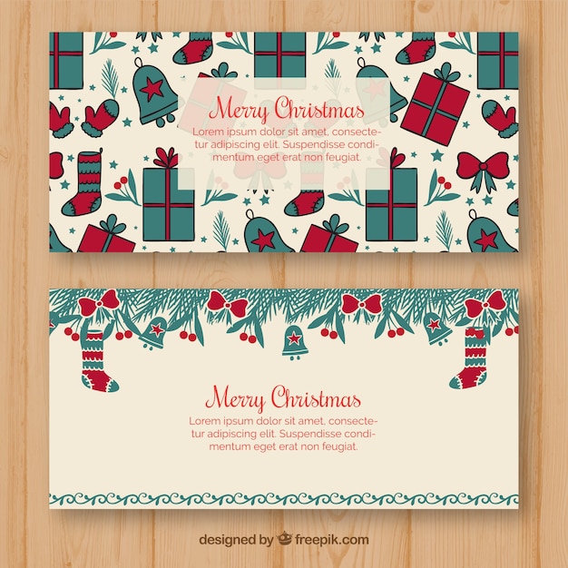 Gratis vector vlakke kerstbanners met geschenkdozen