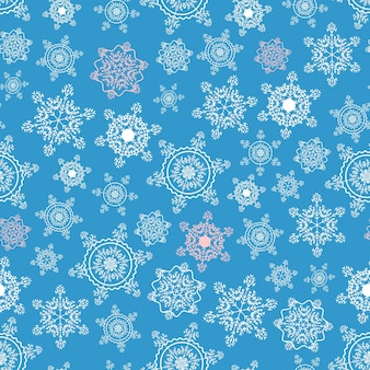 Winterblauw naadloos patroon van sneeuwvlokken voor het ontwerpen van stoffen inpakpapier
