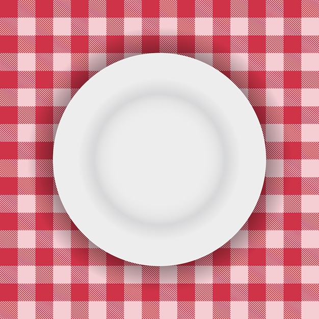Gratis vector witte plaat op een picknick tafelkleed