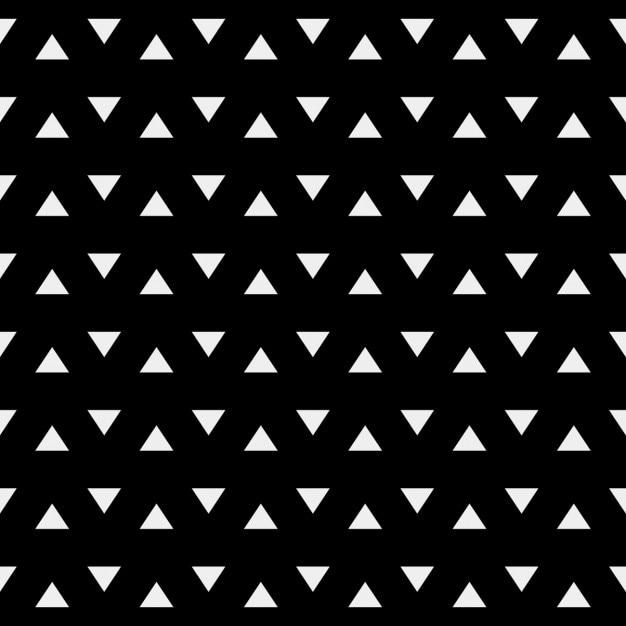 Gratis vector zwart geometrisch patroon met witte driehoeken